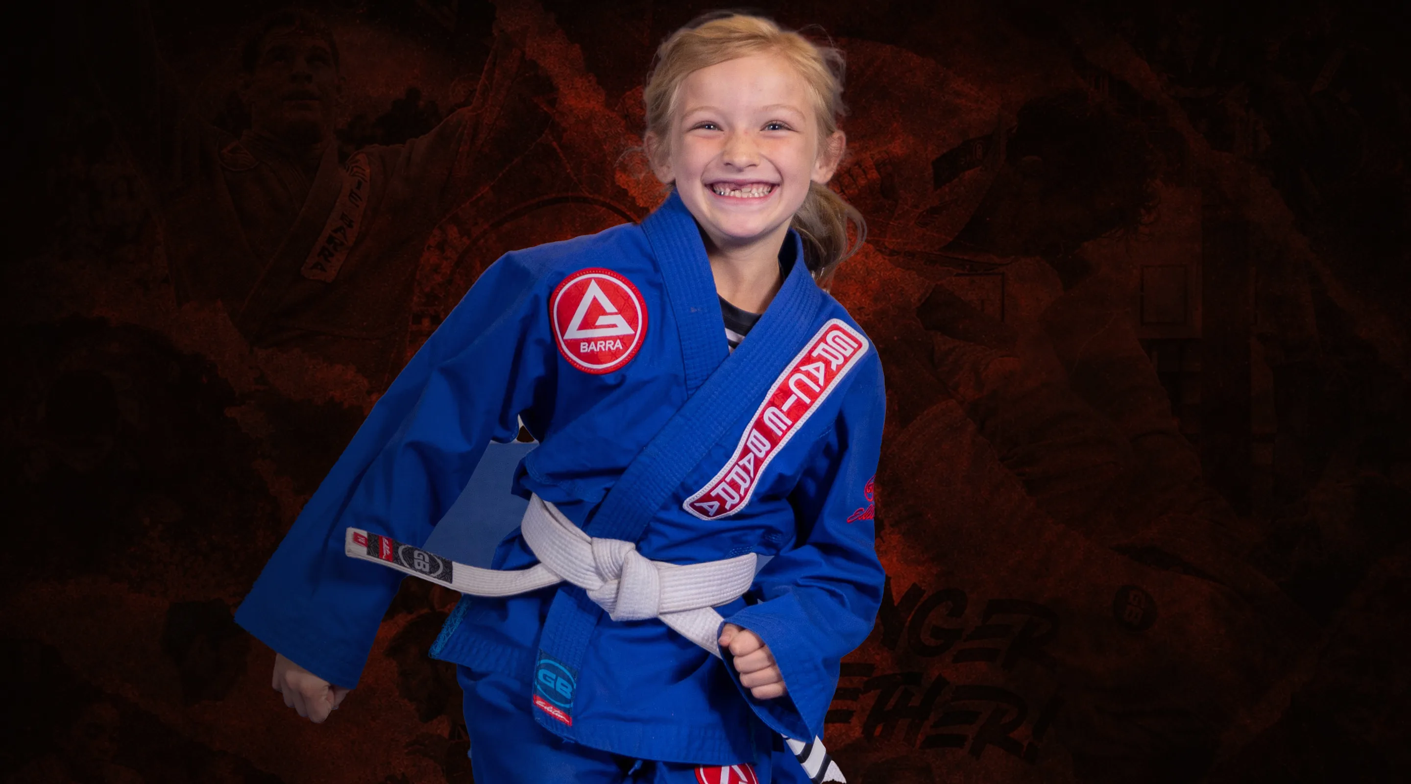 Young student smiling in a blue Gracie Barra gi at Gracie Barra Whittier, Whittier, CA