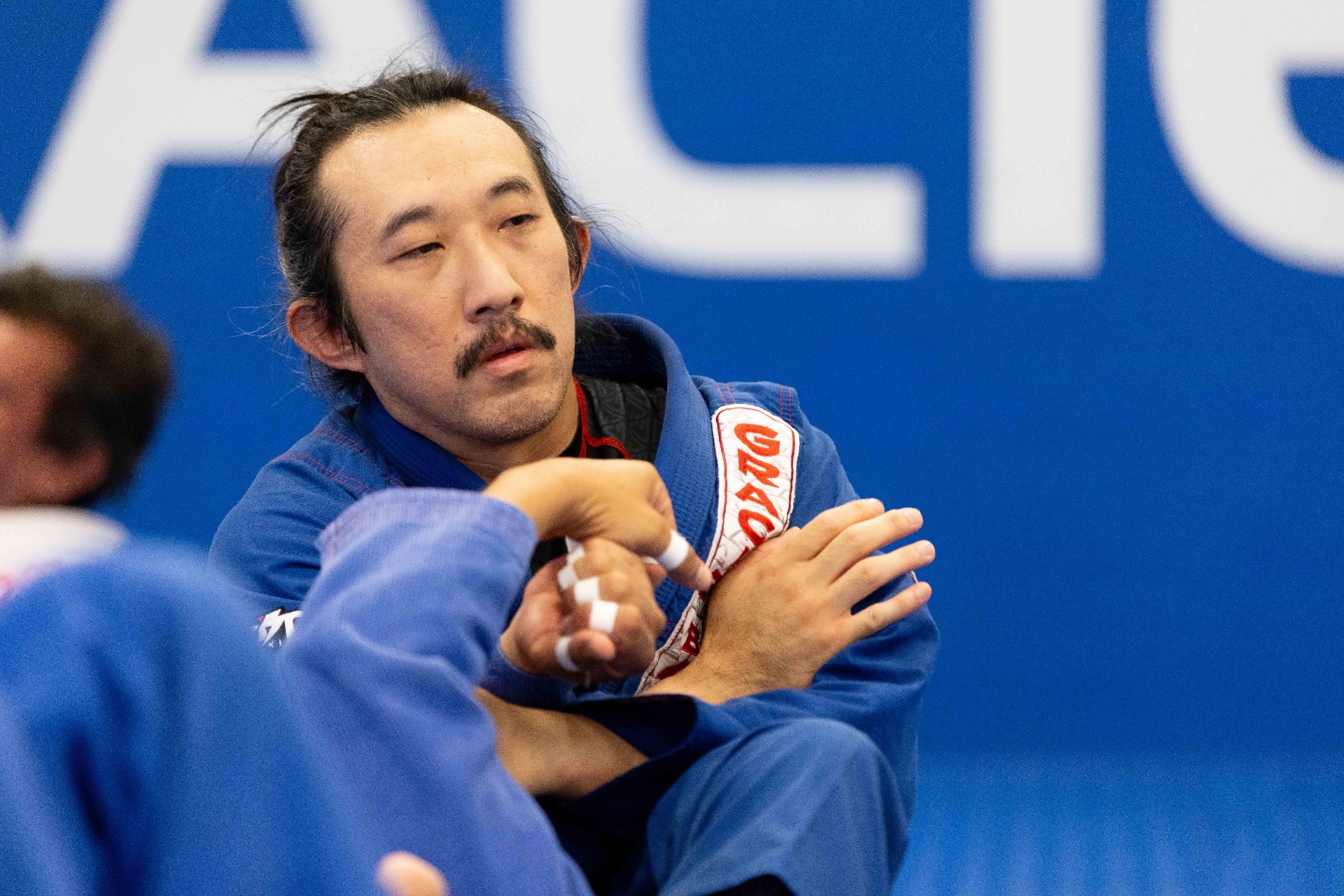 Instructor teaching BJJ technique at Gracie Barra Whittier